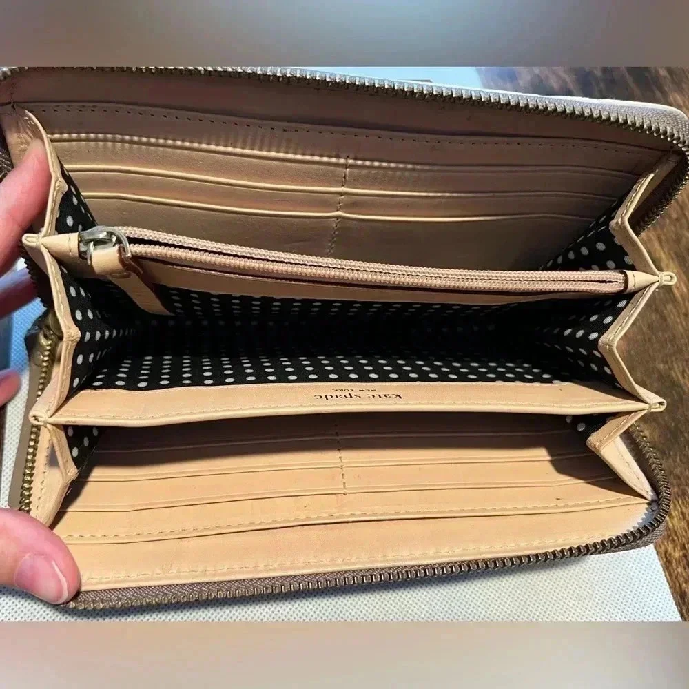 Kate Spade New York| ladies Continental patent leather zip around wallet.
